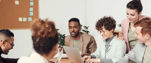 A project team reviewing work together